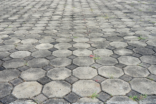Hexagonal concrete pavement tiles background from above