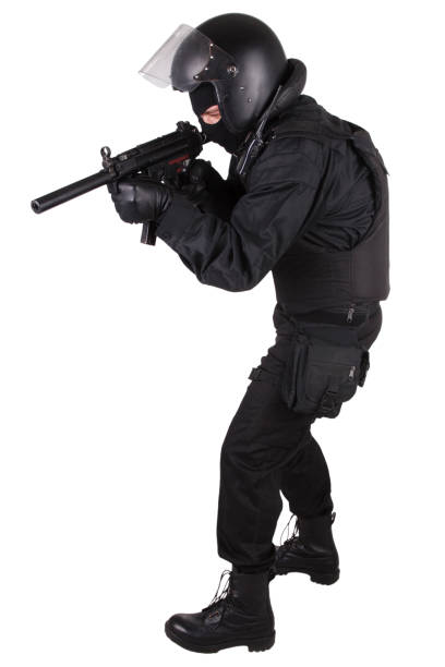istock police special forces officer with submachine gun in black uniform 1187373683