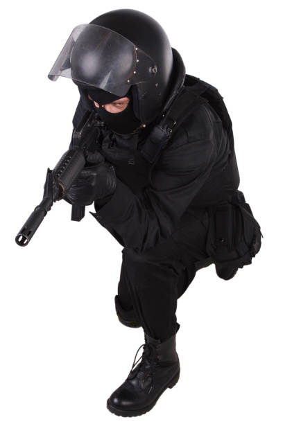 istock SWAT officer with assault rifle in black uniform 1187373752