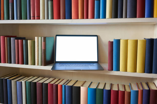 istock Open laptop in accurately arranged bookshelf 1187373804