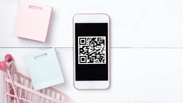 istock Abstract online shopping,mobile payment with QR code design concept element,colorful cart,paper bag on wooden table background,top view,flat lay 1187373876