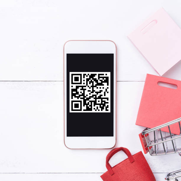 istock Abstract online shopping,mobile payment with QR code design concept element,colorful cart,paper bag on wooden table background,top view,flat lay 1187373877
