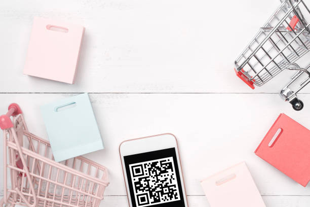 istock Abstract online shopping,mobile payment with QR code design concept element,colorful cart,paper bag on wooden table background,top view,flat lay 1187373927