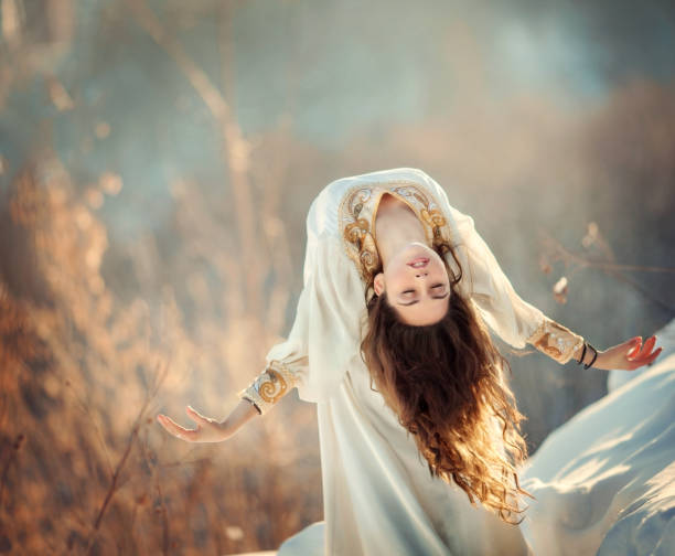 istock Girl and feathers 1187373946