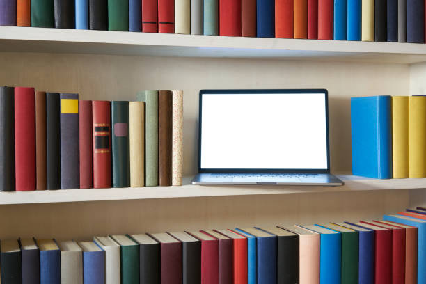 istock Accurate bookshelf with colorful book covers and laptop 1187373953