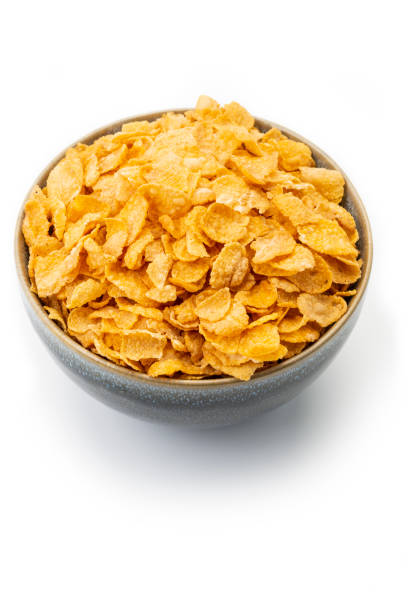 istock Breakfast Ingredients: Corn Flakes Isolated on White Background 1187374444