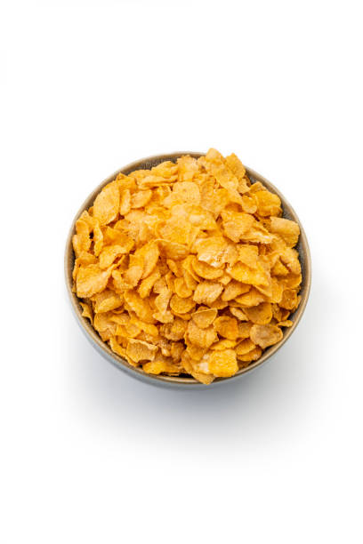 istock Breakfast Ingredients: Corn Flakes Isolated on White Background 1187374478