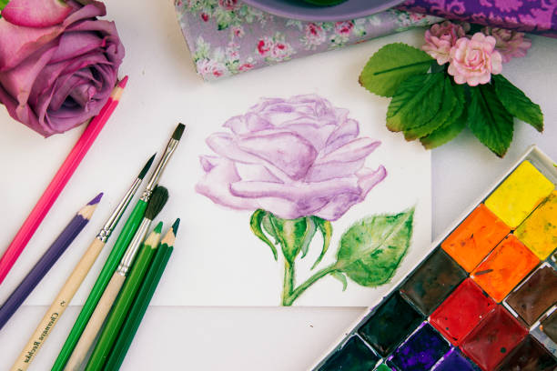 istock composition with watercolor paints, sketch with pencils 1187374526