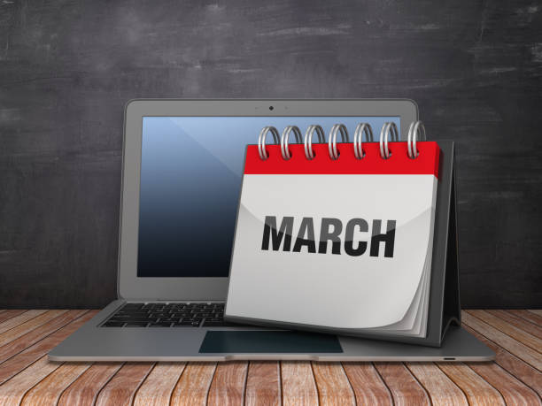 istock MARCH Calendar with Computer Laptop on Chalkboard Background - 3D Rendering 1187375217