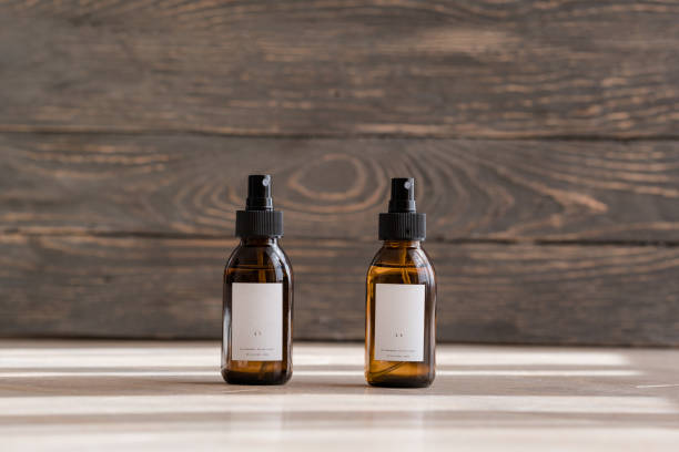 istock Cosmetic dark amber bottles on wooden  table 1187375588