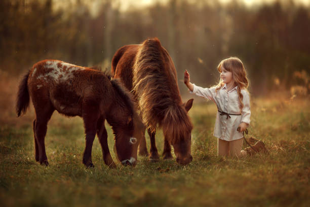 istock Girl and horse 1187380627