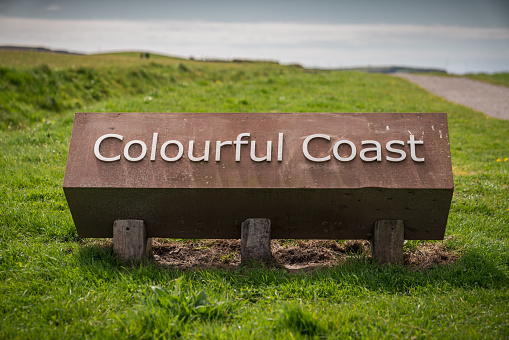 Sign: Colourful coast, seen in Whitehaven, Cumbria, England, UK
