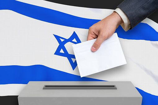 Election in Israel - voting at the ballot box. The hand of man is putting his vote in the ballot box. 3D rendered illustration.