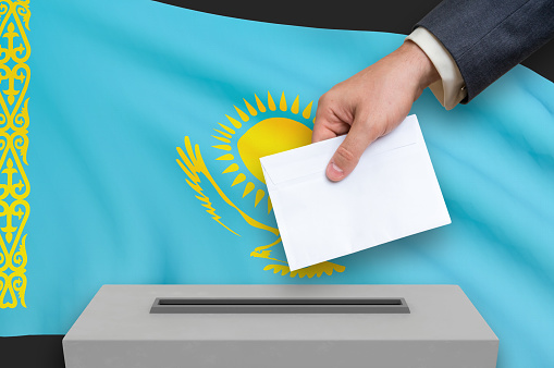 Election in Kazakhstan - voting at the ballot box. The hand of man is putting his vote in the ballot box. 3D rendered illustration.