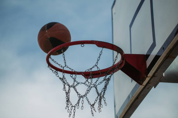 istock Basketball hoop net and ball side view 1187393192