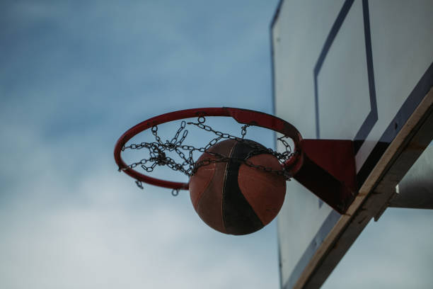 istock Basketball hoop net and ball side view 1187393193