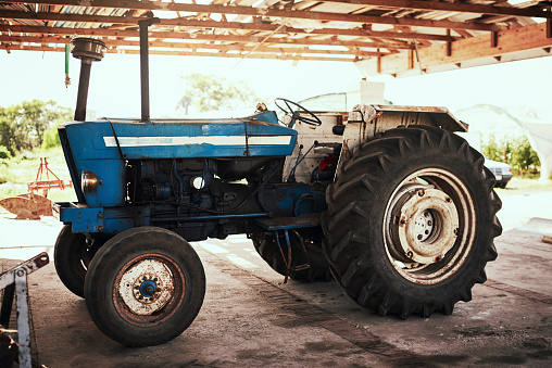 Still life shot of a tractor parked at a farm
