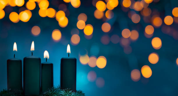 istock advent candles at christmas holidays shining at night 1187396592