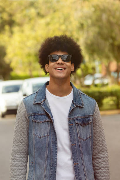 istock Handsome guy with afro hairstyle and sunglasses 1187396737
