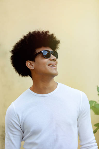 istock Handsome guy with afro hairstyle and sunglasses 1187396748