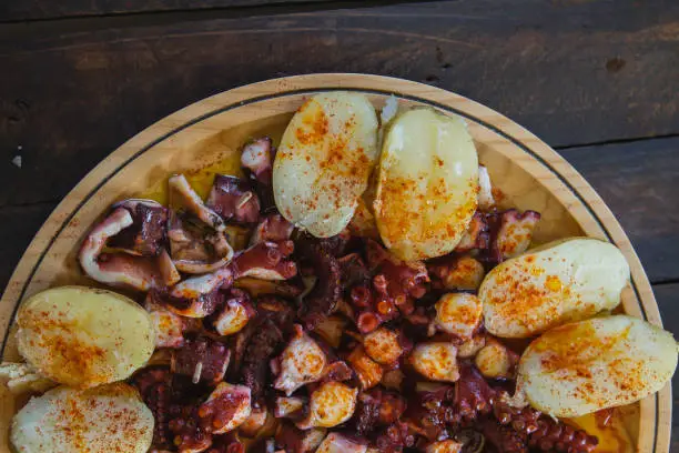 Photo of Detail of octopus with potatoes dish