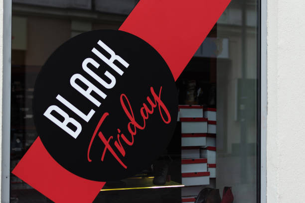 istock Window display with red sale board for Black Friday shopping. 1187399612