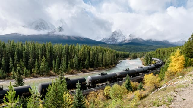 Canadian freight train passing through on Morant's curve in Banff national park