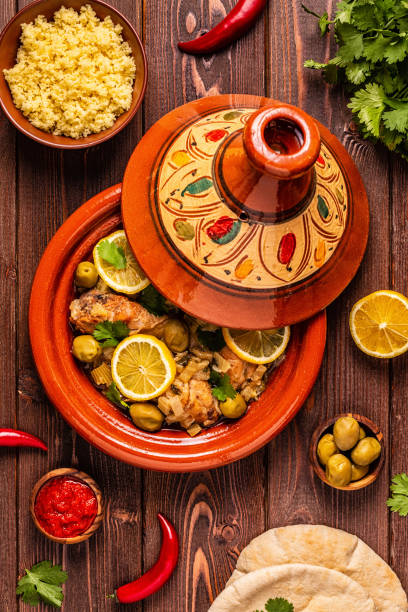Traditional moroccan tajine of chicken with salted lemons, olives. Traditional moroccan tajine of chicken with salted lemons, olives. Top view. tajine stock pictures, royalty-free photos & images