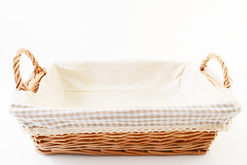 Brown wicker basket isolated over white