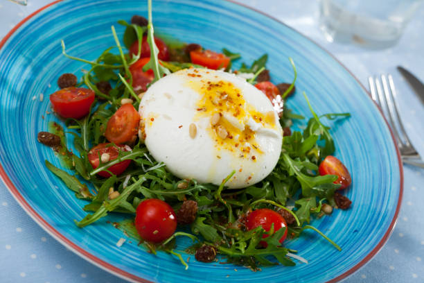 istock Burrata salad with arugula and tomatoes 1187406648