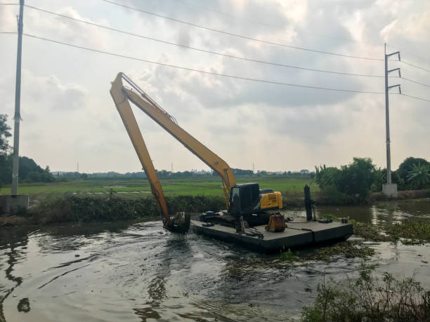 istock BackHoe Excavator Machine digging canal at Thailand 1187411764