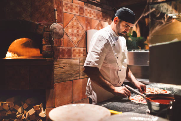istock Pizza maker in the kitchen preparing Neapolitan pizza 1187411972