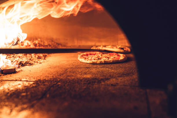 istock Neapolitan pizza baking in flaming wood fired oven 1187411988