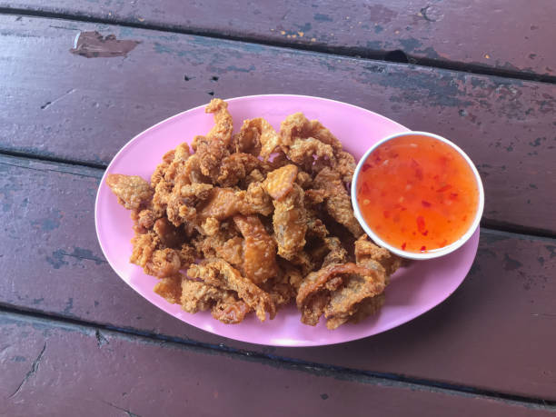 istock deep fried skin chicken on plate with sauce 1187412808
