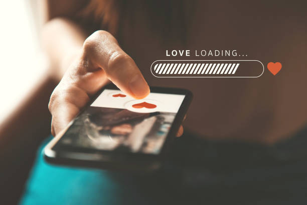 istock Love loading progress, Woman pushing heart icon on screen in mobile smartphone application. Online dating app, valentine's day concept. 1187414255
