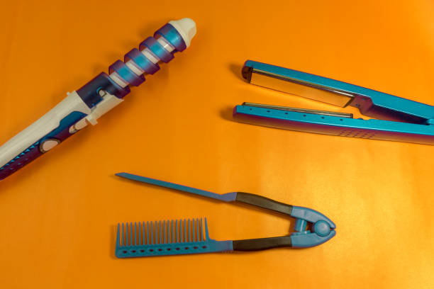 istock HAIRDRESSING OBJECTS SUCH AS HAIR STRAIGHTENER ON STRIKING 1187414395