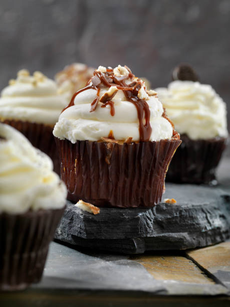 istock Chocolate Buttercream Cupcakes with Walnuts and a Chocolate Drizzle 1187414661