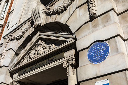 London, UK - February 26th 2019: A blue plaque on Bonham Carter House in Gower Street in London, marking the location where the first Anaesthetic given in England was administered.