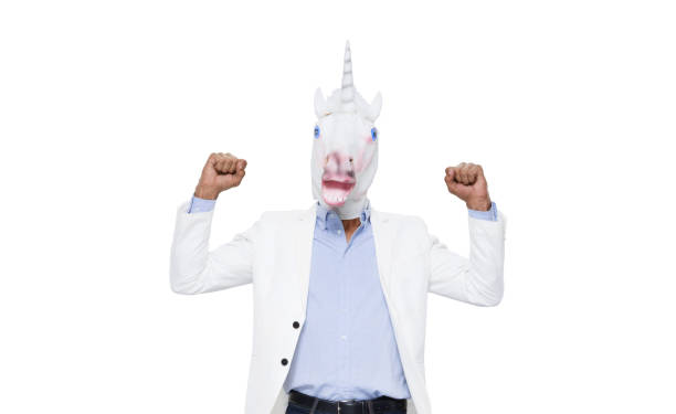 One man only / one person / waist up / portrait of 20-29 years old adult handsome people black hair african ethnicity / african-american ethnicity male / young men wearing mask - disguise / jeans / pants / blazer - jacket / jacket / button down shirt / shirt who is bizarre / wearing a unicorn mask / horse un hombre sólo / una persona / cintura para arriba / retrato de 20-29 años de edad adulto guapo personas personas negro pelo étnico africano / etnia afroamericana macho / hombres jóvenes que es extraño / usando una máscara de unicornio / caballo