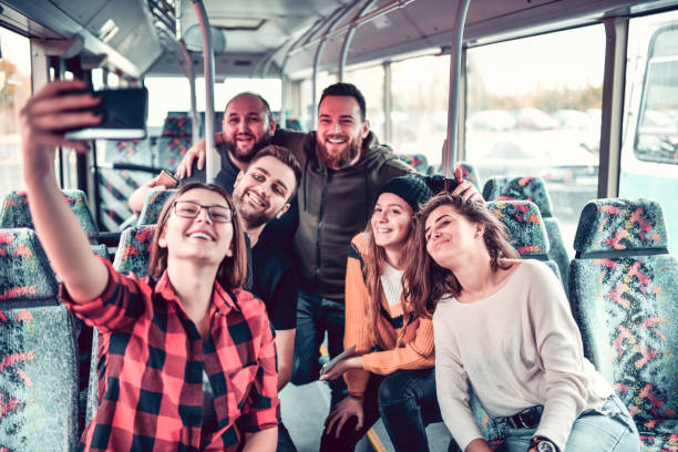 istock Friends Taking Selfie During Bus Trip 1187418297
