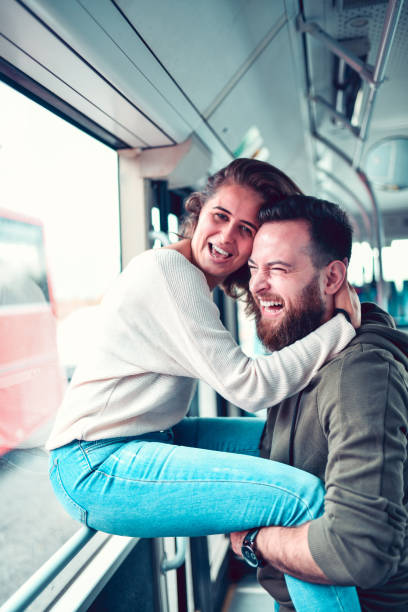 istock Male And Female Embracing On Bus 1187418412