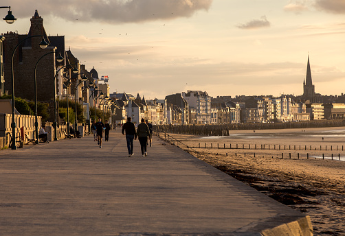 St Malo, France - September 14, 2018: People walking along promenade at seafront in Saint Malo, Brittany, France