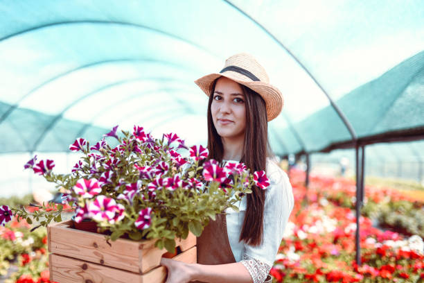 istock Beautiful Female Presenting Her Wonderful Lilies 1187419677