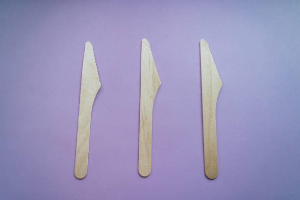 istock Bamboo knives on pink background. Eco friendly concept. Top view. 1187420502