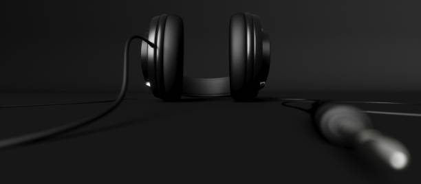 istock headphones on a black background close-up 1187421346