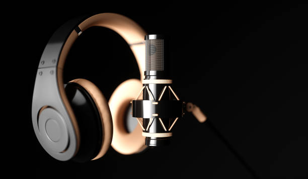 istock black microphone on a black background close-up with headphones 1187421390
