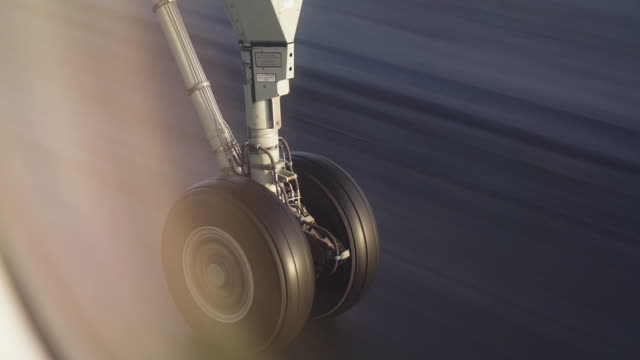 Airplane landing gear takeoff and retraction in Helsinki airport Finland