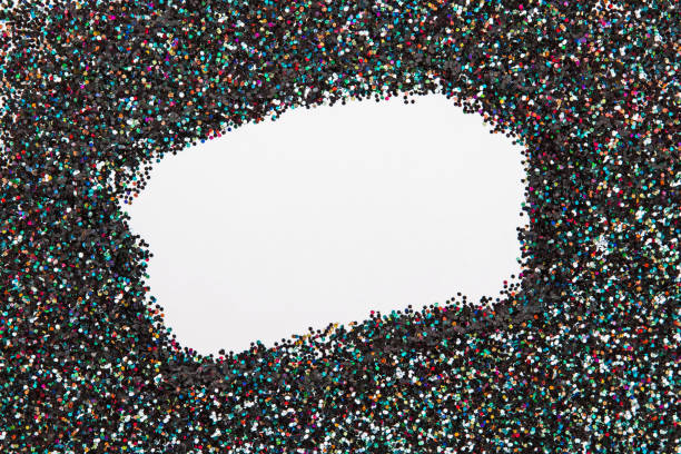 istock Holographic glitter on black background with empty blank space in the center. 1187423697