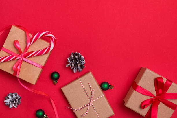 istock Christmas flat lay with gift boxes and pine cones 1187426107