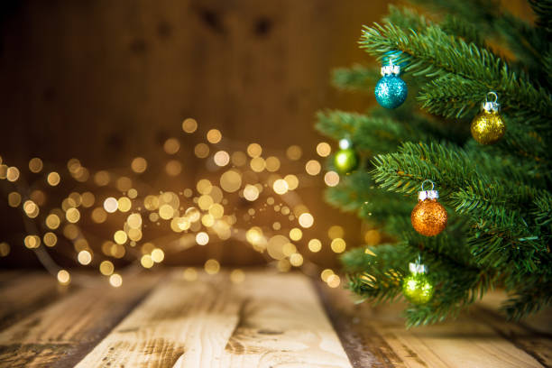 istock Christmas Tree, Wooden Floor and Defocused Lights 1187431666